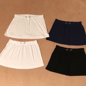 NWT set of 4 Venus beach or pool coverup mini skirts bundle. Mainly XS.